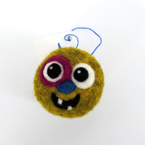 Felted Monster Head Ornaments Green Monster with Purple Rimmed Eye - Arts and Heritage St. Albert