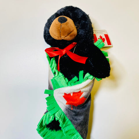 Coodles critter in a blanket black bear - Arts and Heritage St. Albert